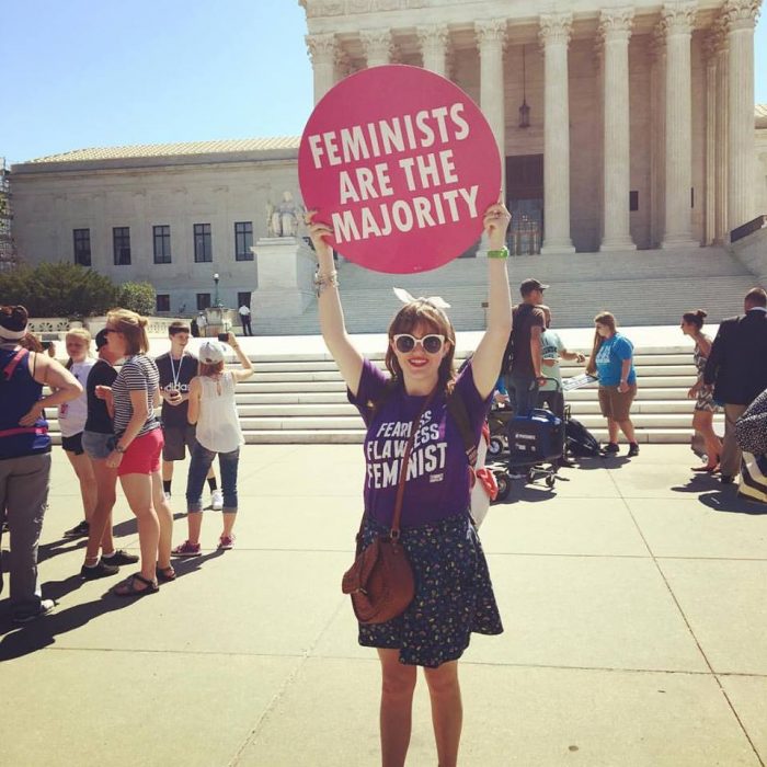 I hold up a sign in front of the Supreme Court